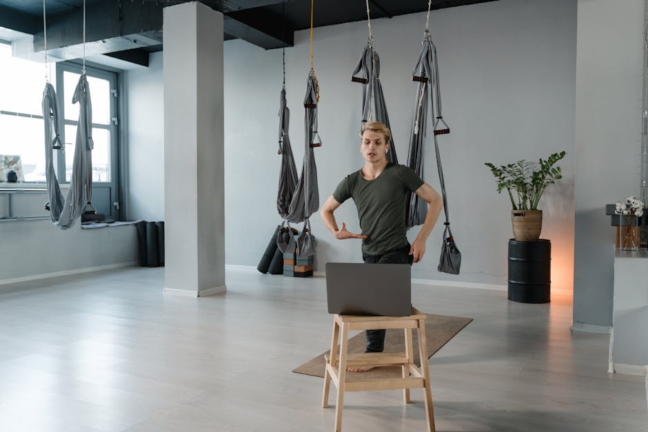 People stretching and exercising in modern office environment