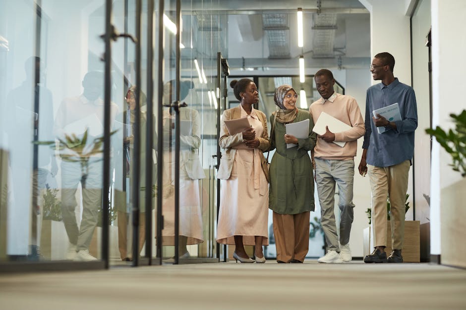 Person walking in modern office hallway